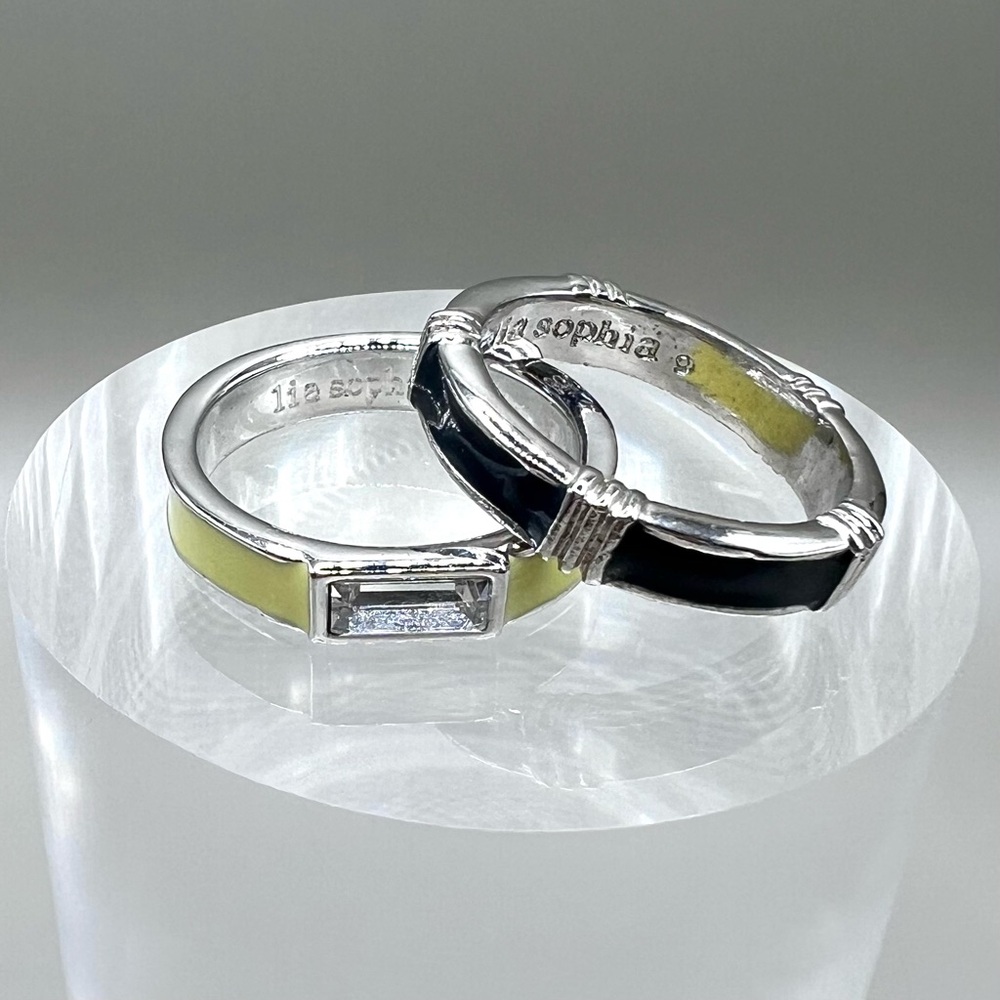 lia sophia set of Sz 9 rings “Ray of Light” & “Bar None” pale yellow & navy blue